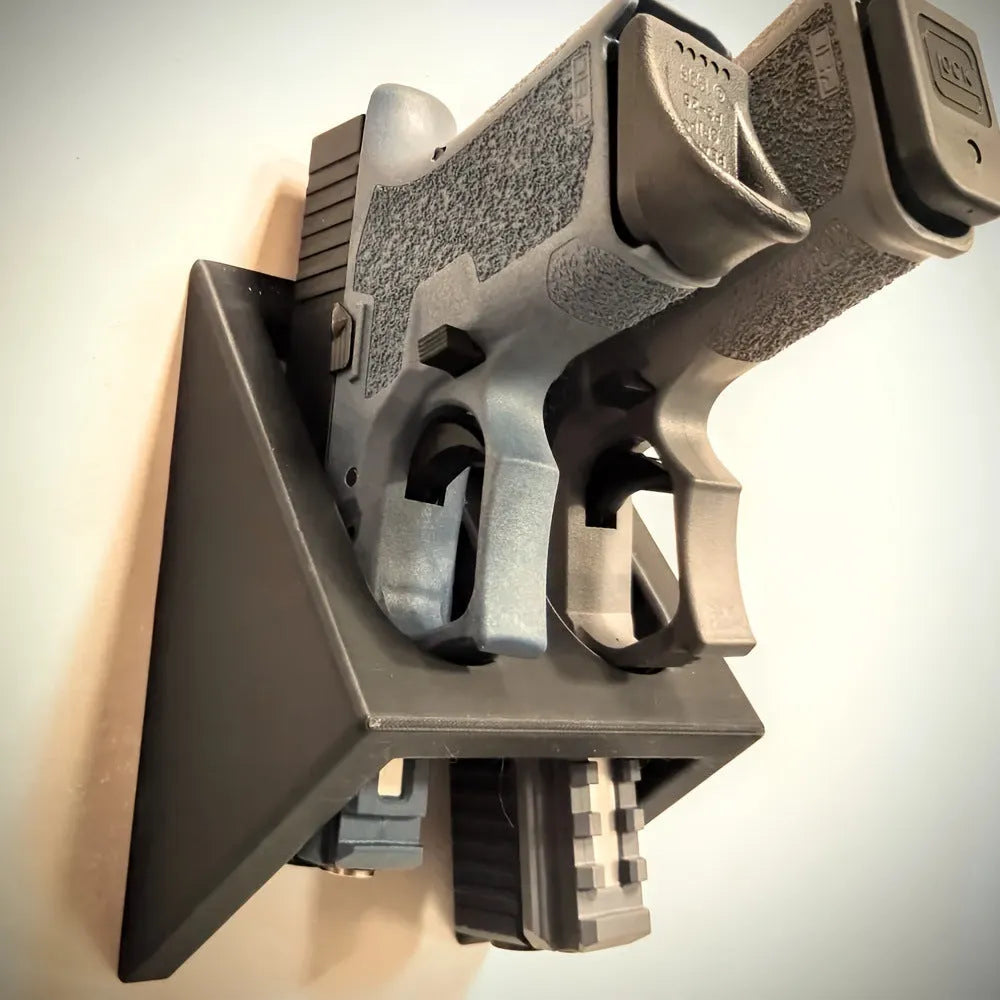 Black punk-style plastic pistol stand for firearm storage and display