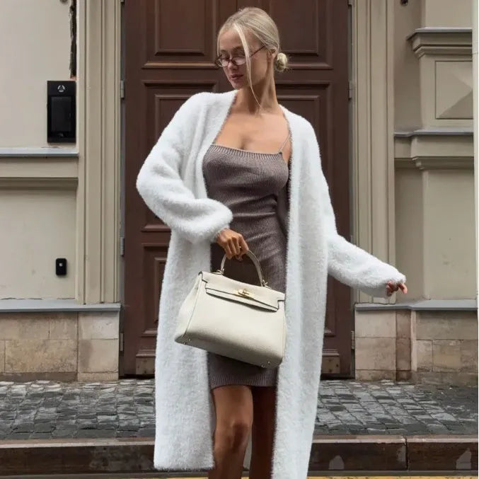 White women's longline cardigan sweater with loose fit and long sleeves.