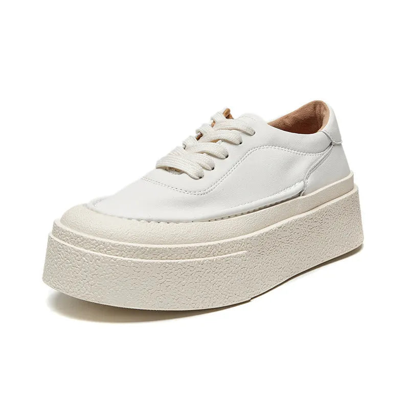 Women's black platform sports board shoes made from embossed cowhide leather with a rubber sole.