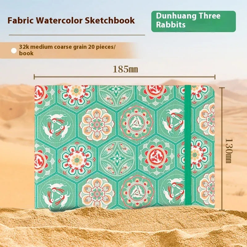 Feiluniao handmade fabric watercolour notebook in 185mm portable size, showing artistic cover design.