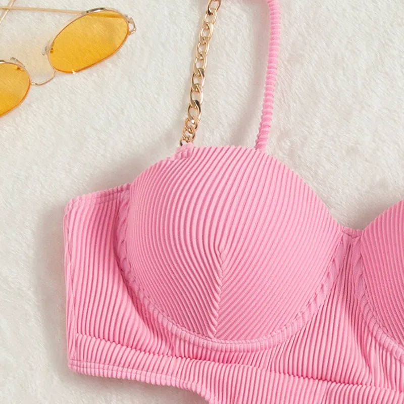 Ladies one piece solid colour swimsuit with chest pad, available in black and pink, sizes S M L