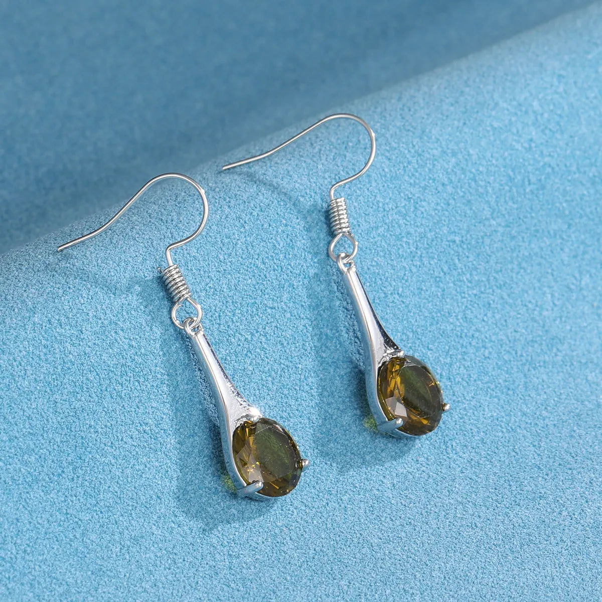 Olive green topaz colour drop-shaped earrings with minimalist retro style design