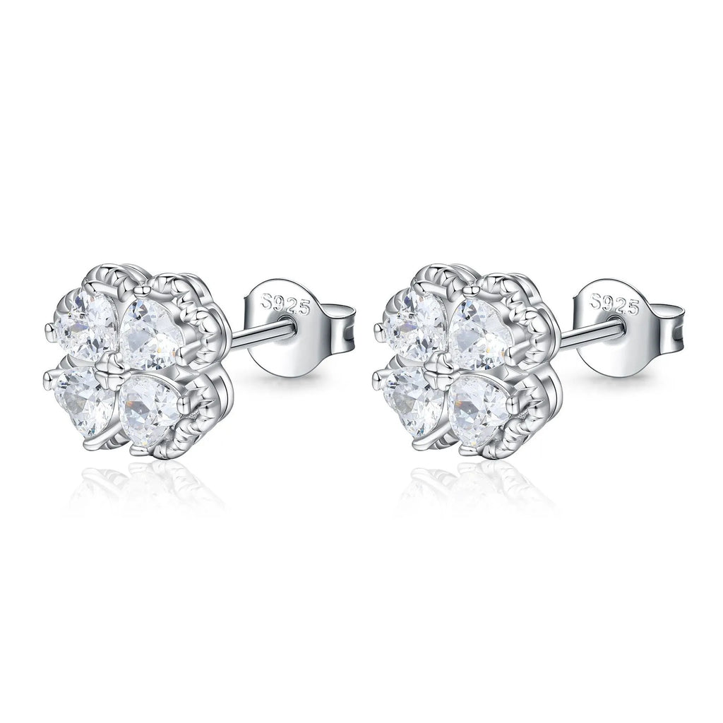 Pair of heart-shaped silver earrings with a four-leaf clover design and zircon stones.