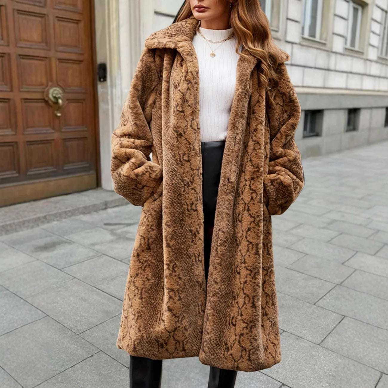 Women's long faux fur coat with leopard print pattern, featuring regular sleeves and an over-the-knee length.