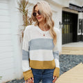 Women's short striped loose pullover sweater in acrylic fabric on a hanger.