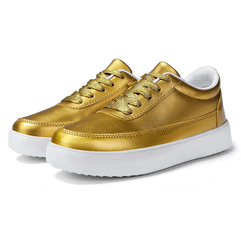 Women's gold leather lace-up casual flat shoes with a flat heel on a white background.