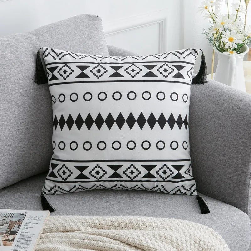 Bohemian style throw pillow on a sofa, available in light grey, black, or white, shown in 45x45cm size.