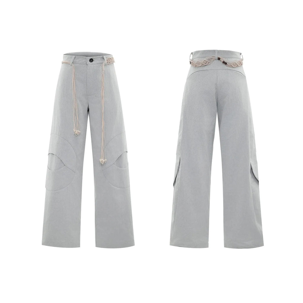 Men's dark wash straight-leg jeans with 3D cutting, zip decorations, and tassel details