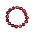 Women's handmade watermelon crystal bracelet showing pastoral design elements on wrist