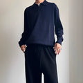 Pure wool polo sweater with a lapel collar in loose fit, shown in Navy Blue.