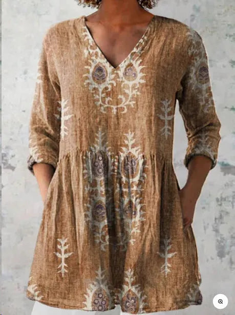 Women's printed wave pattern loose dress with wide waist and 3/4 length sleeves.