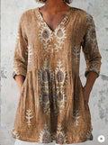 Women's printed wave pattern loose dress with wide waist and 3/4 length sleeves.