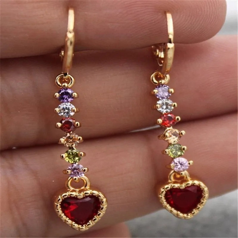 A pair of women's heart-shaped alloy earrings in a gold or silver electroplated colour.