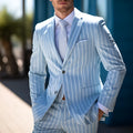 Blue men's British-style suit jacket with double button front and white buttons
