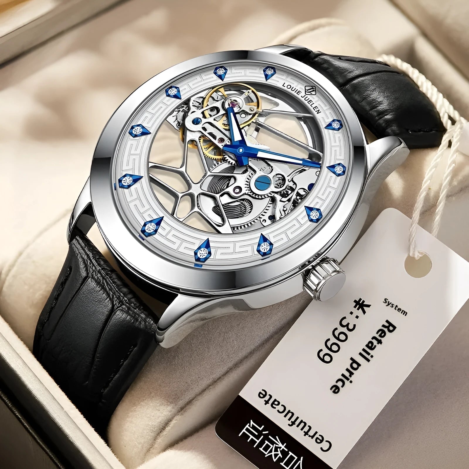 Men's silver case mechanical watch with white dial, blue hands, black leather strap, and stainless steel buckle