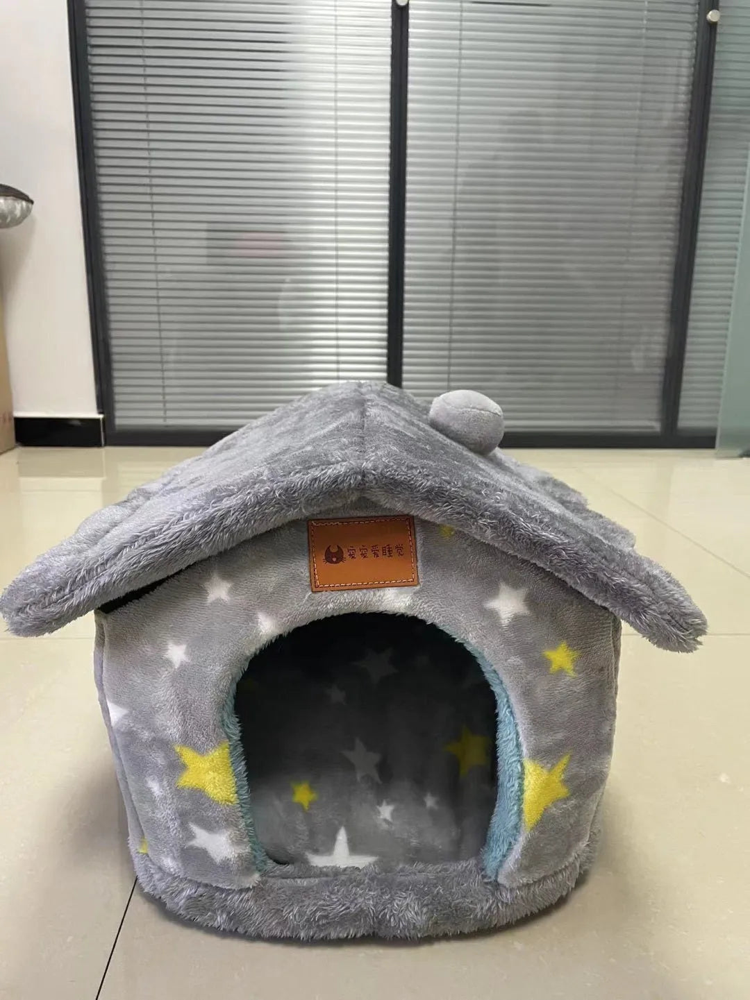 Foldable dog house pet cat bed in cave style with self-warming plush fur and non-slip bottom, available in multiple colours and sizes