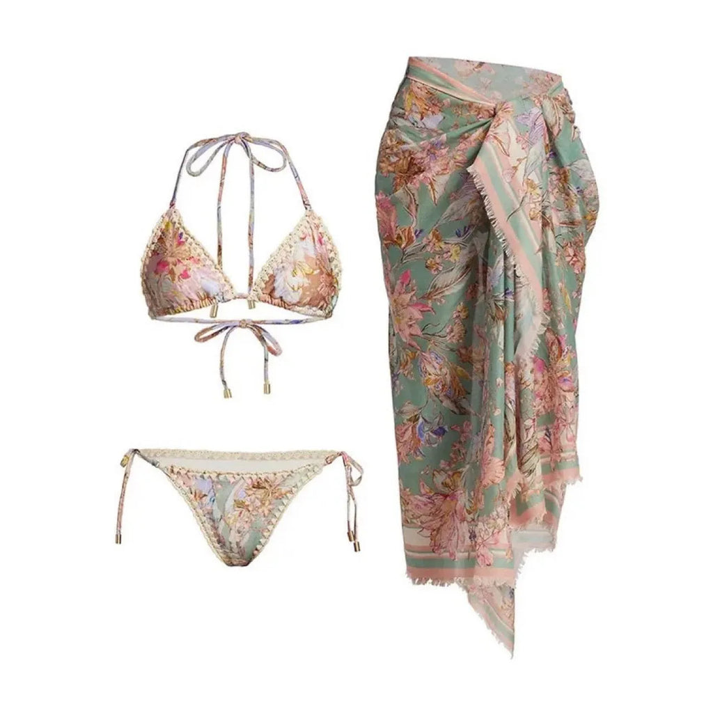 Women's floral bikini swimsuit set with skirt in creamy-white colour, showing top, briefs, and cover-up components