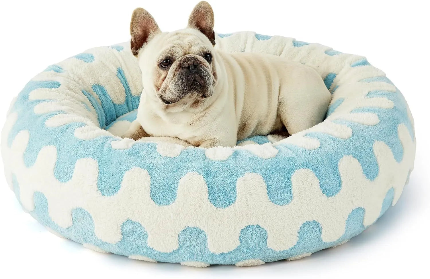 Round plastic dog bed with plaid fabric cover in blue and white pattern