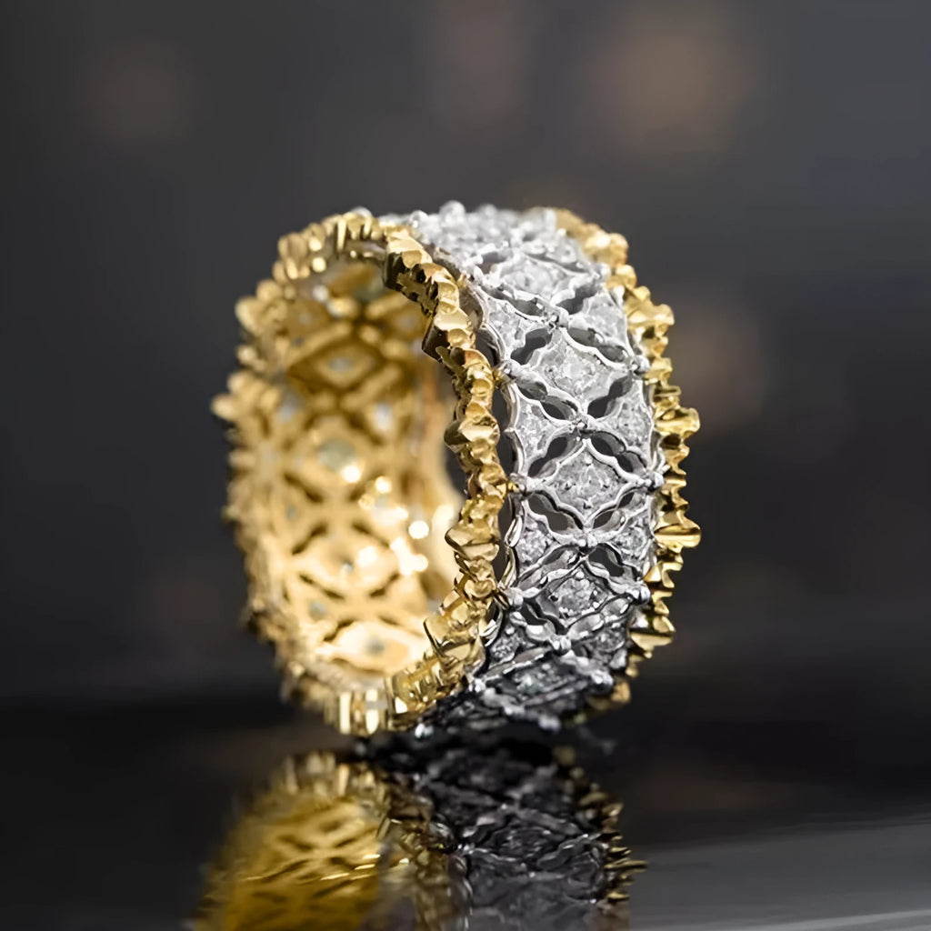 Geometric two-tone gold zircon ring on a copper band, showing round design elements.