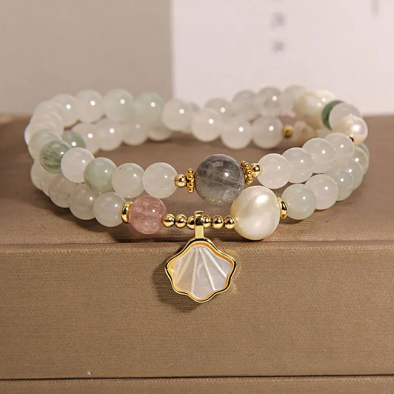 Tianshan emerald green crystal bracelet with gold-plated ginkgo leaf pendant and rhinestone details