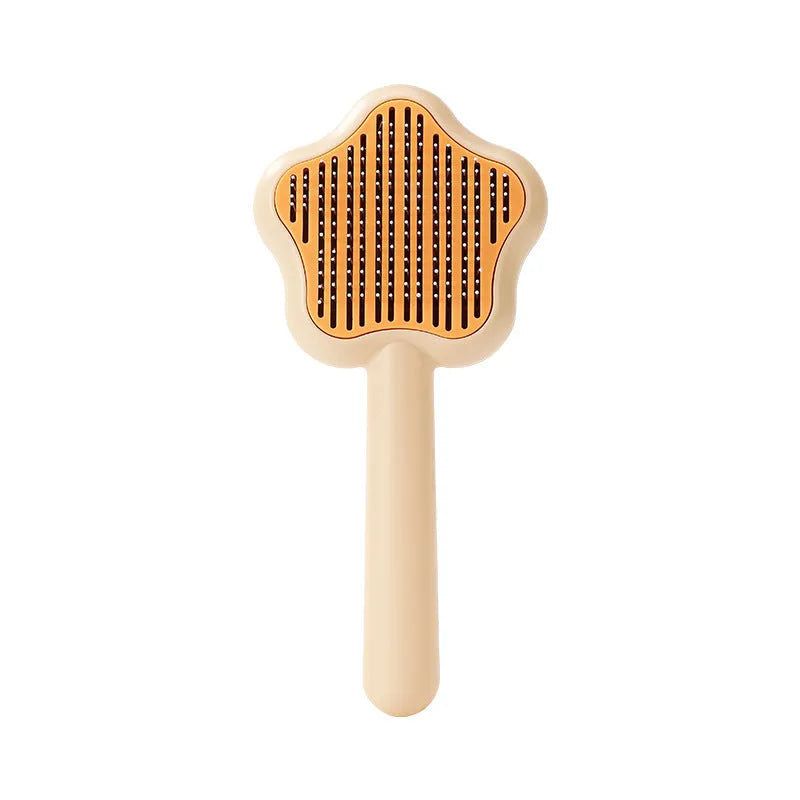 Green self-cleaning cat comb with stainless steel needles and retraction button