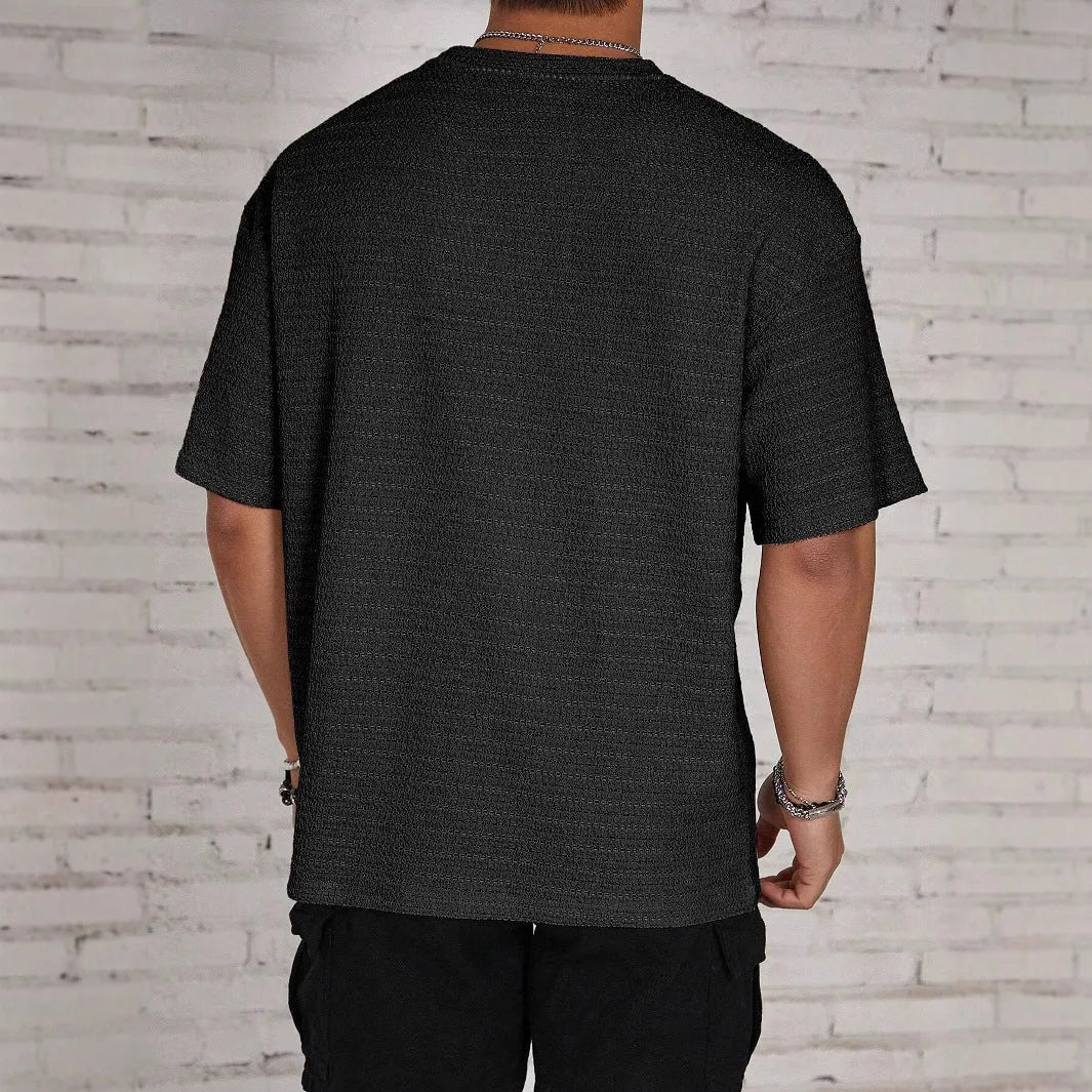 Men's slim fit solid colour T-shirt in light blue, showing round neck and short sleeves