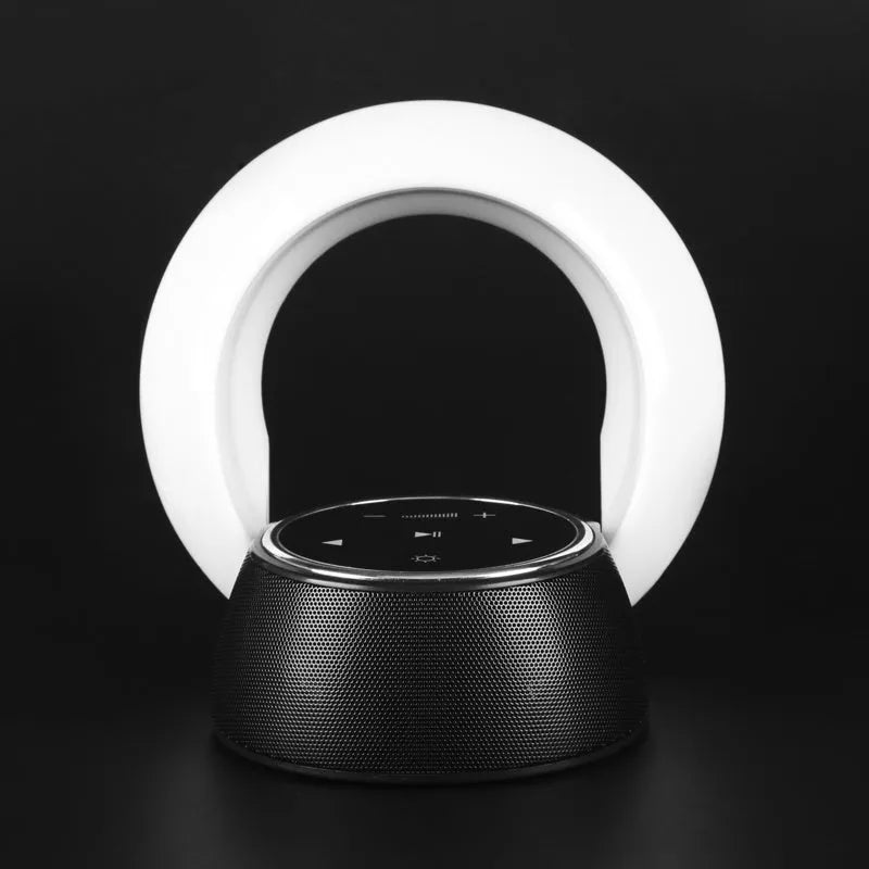 Bluetooth desk lamp with speaker showing folding design, touch controls, and LED lighting in plastic housing