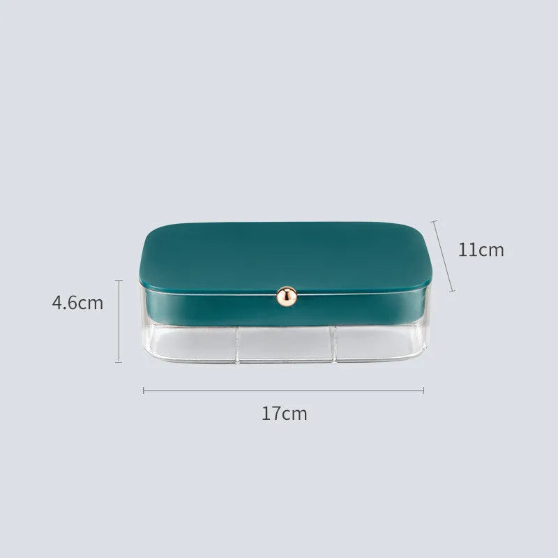 Green minimalist jewellery storage box with multiple internal compartments for rings and earrings.