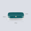 Green minimalist jewellery storage box with multiple internal compartments for rings and earrings.