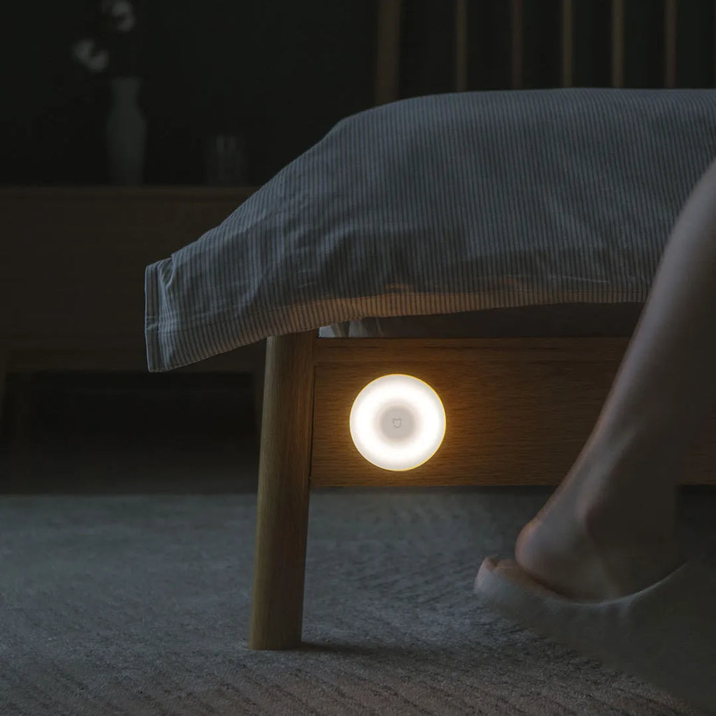 White modern Mijia Night Light 2 Bluetooth bedside lamp with motion sensor on a table.