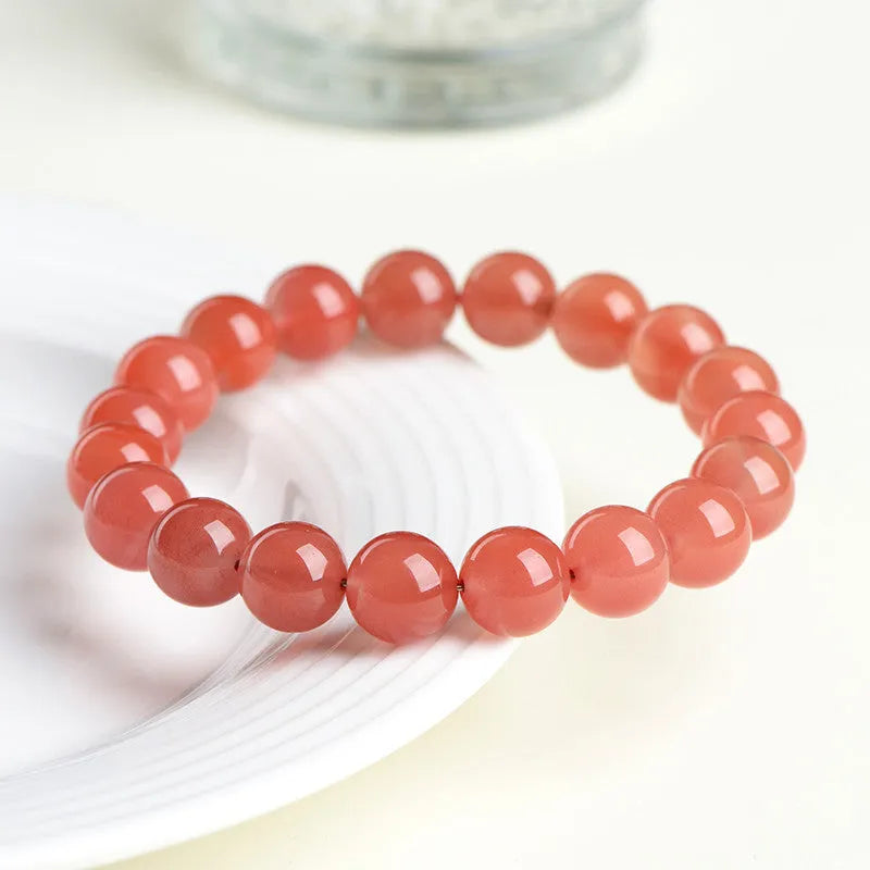 Natural South Red Cherry Red Agate bead bracelet shown in single and three-strand styles.