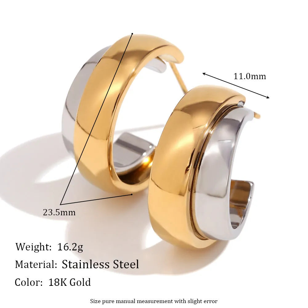 Gold geometric stainless steel earrings, bracelet, and necklace set on a white background.
