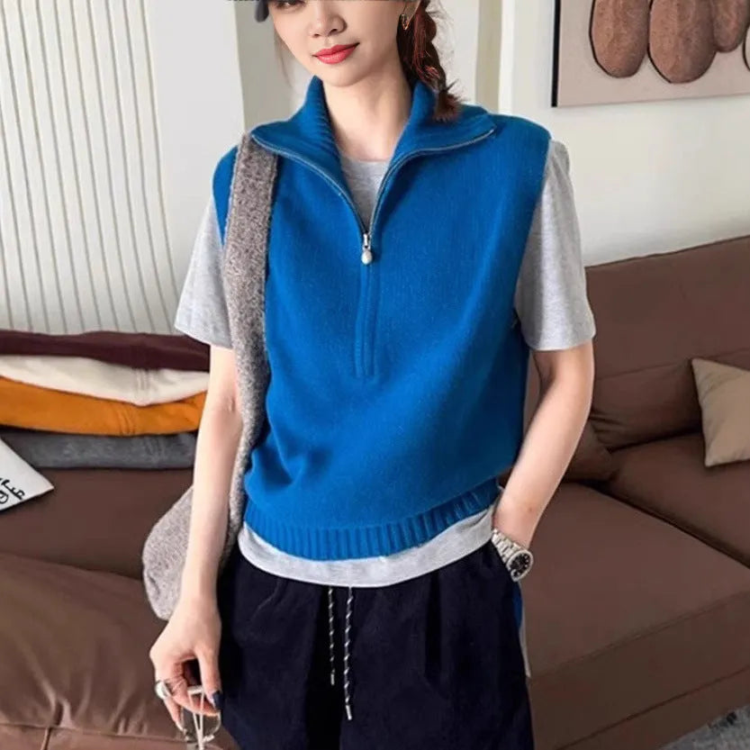 Orange retro half zip sleeveless mesh knit vest with 3D pattern showing front view