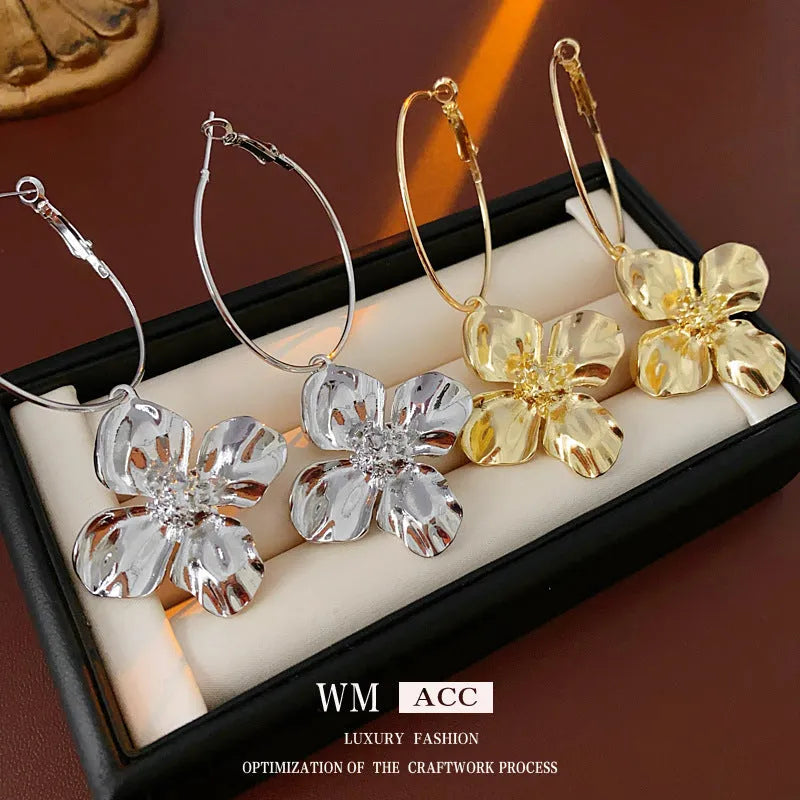 Silver needle metal flower earrings with geometric design in gold and silver electroplated finish
