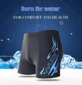 Men's boxer style swimming trunks in blue fire pattern on black background