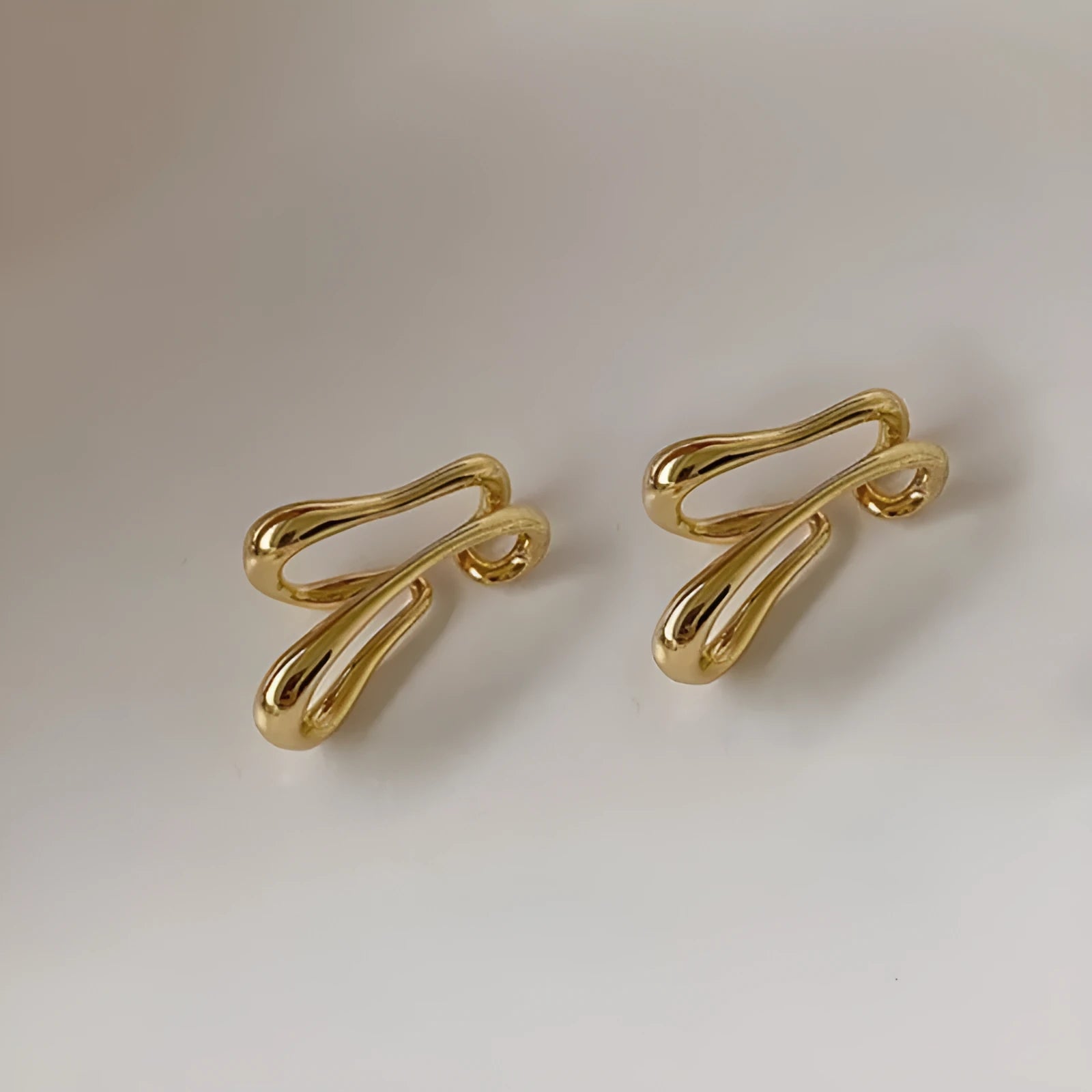 Double-layer geometric line copper ear clip earrings in gold and silver finish for women