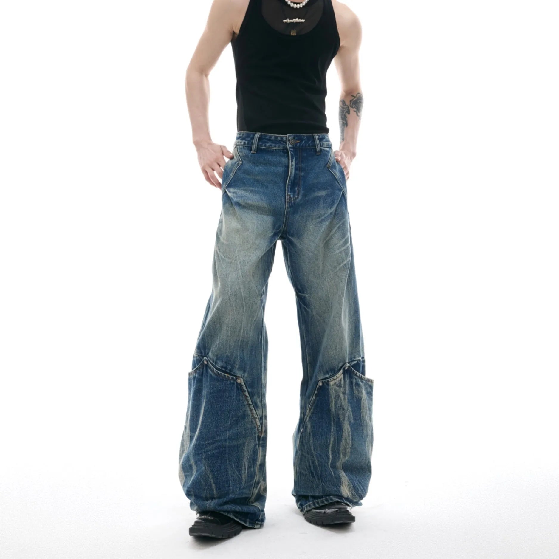 Men's verdant blue jeans with retro washed burst pattern and curved knife design on loose fit trousers