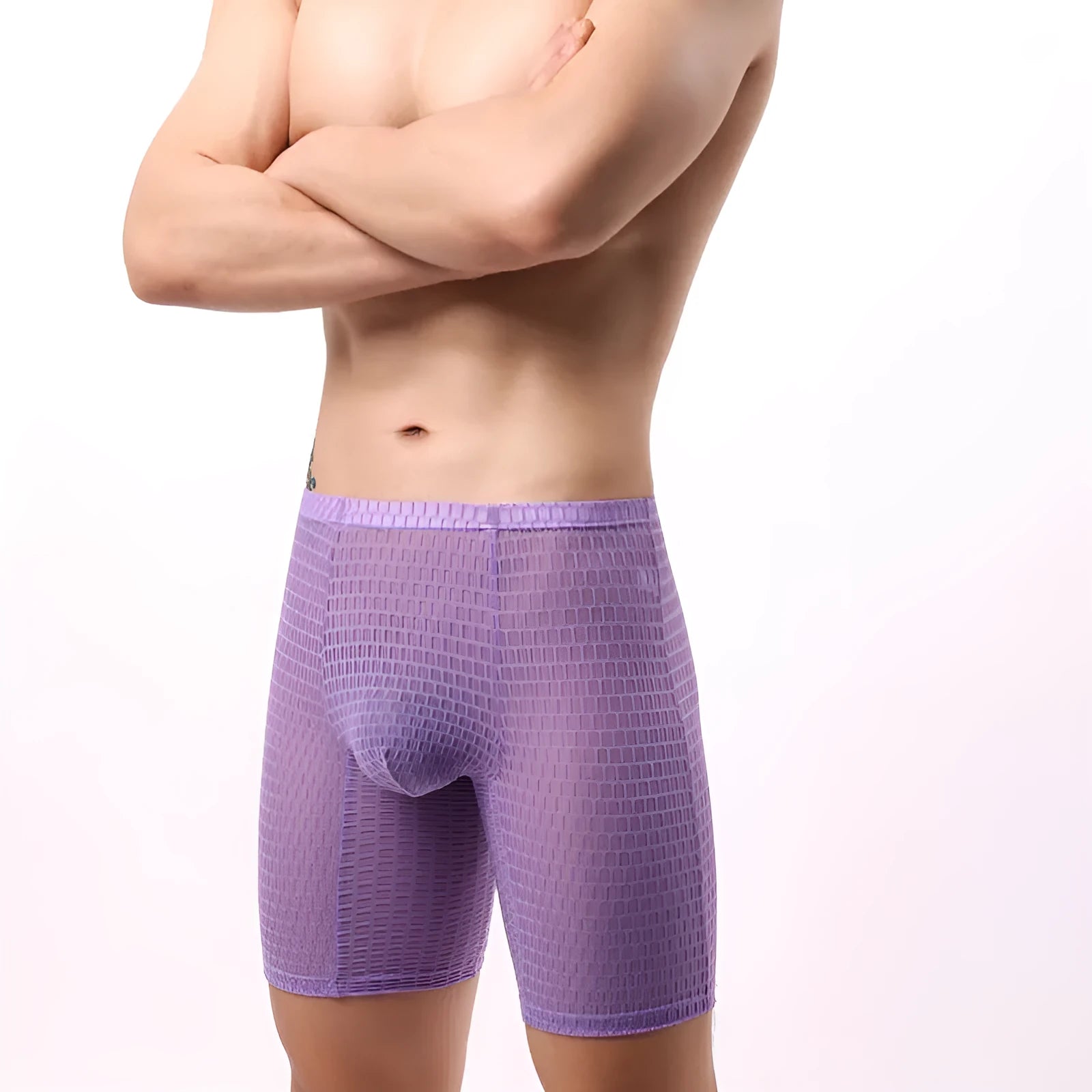 Men's lengthened transparent lace boxer shorts on a neutral background, showing mid waist and leg detail.