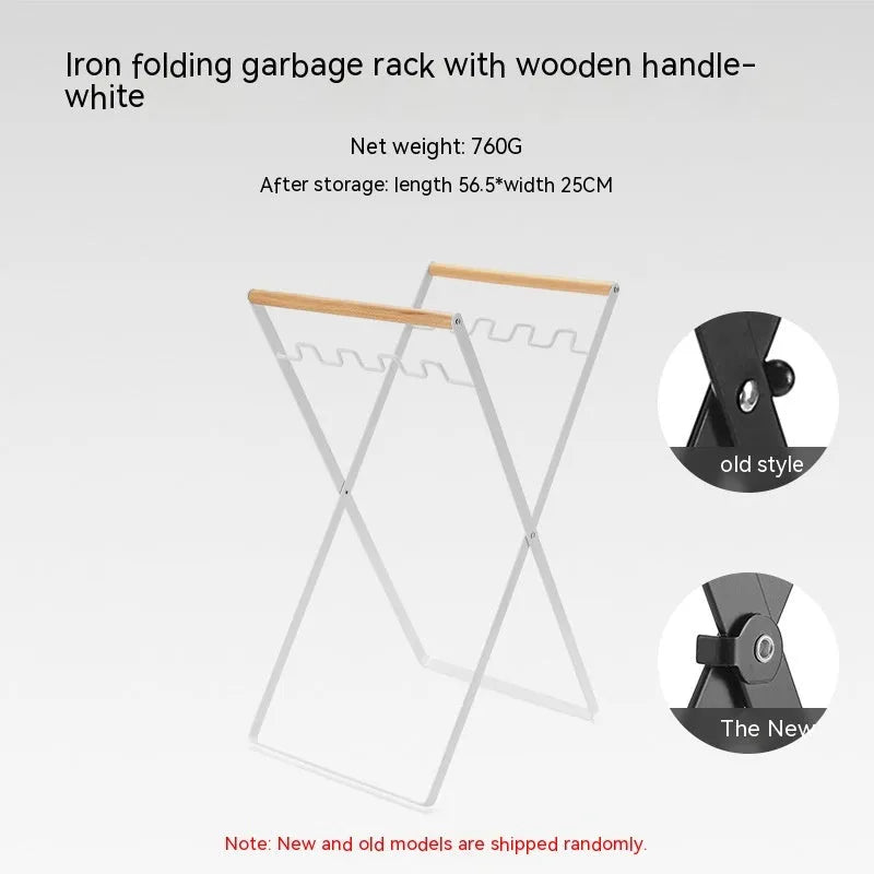 Black outdoor folding iron trash rack with a wooden handle, holding a bin bag.