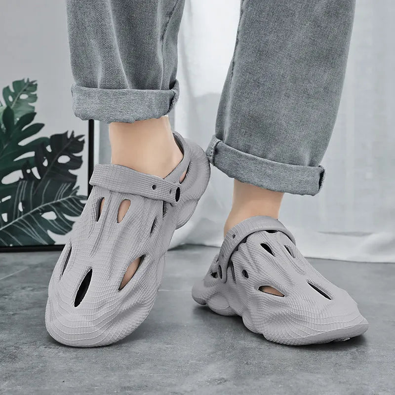 EVA soft men's summer beach shoes in grey colour on sandy surface