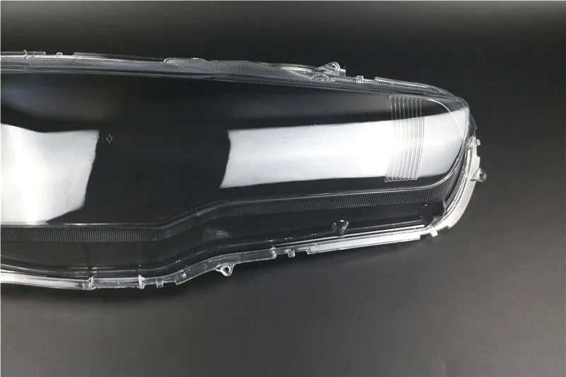 Transparent plastic headlight housing cover for vehicle replacement measuring 50x30x20mm