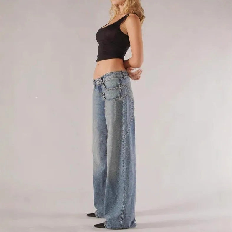 Blue cotton loose straight wide leg women's trousers on a hanger, showing low waist and stitching detail.