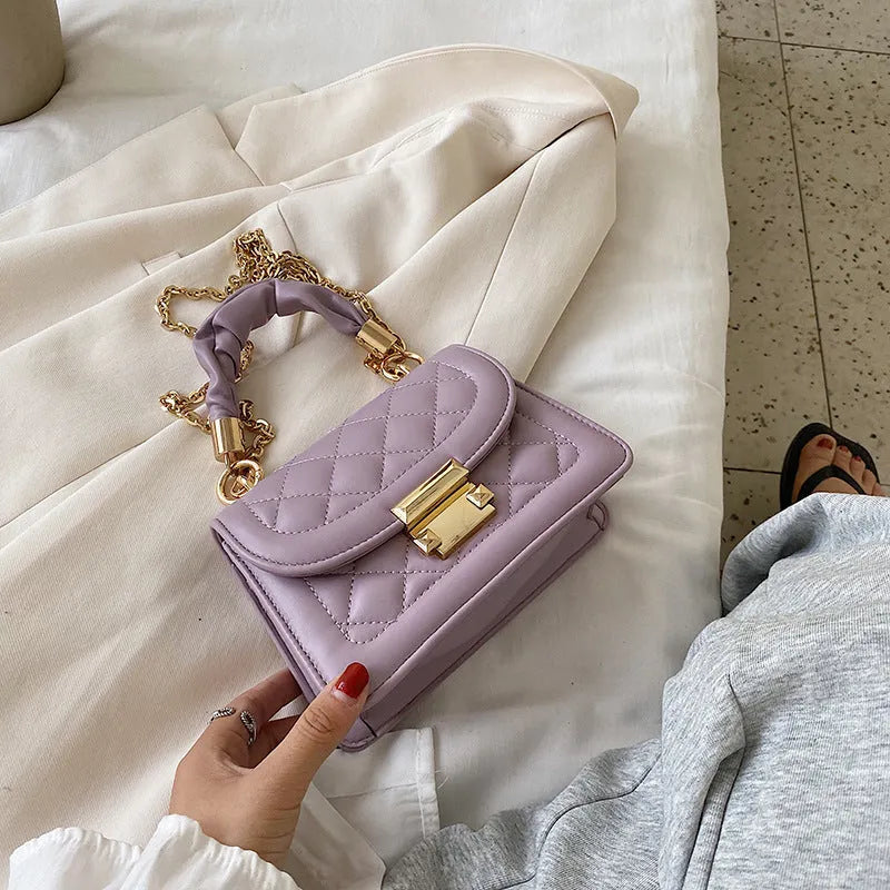 Women's Korean-style shoulder bag with rhombus pattern in purple colour showing crossbody wearing style
