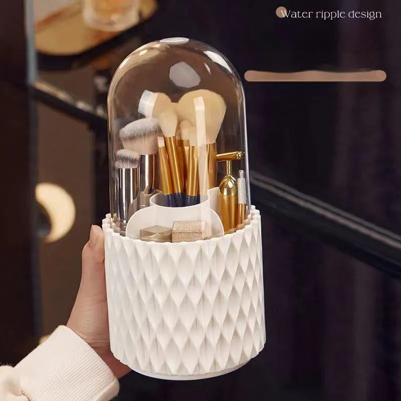 White rotating transparent makeup brush storage tube with dust cover lid on desktop