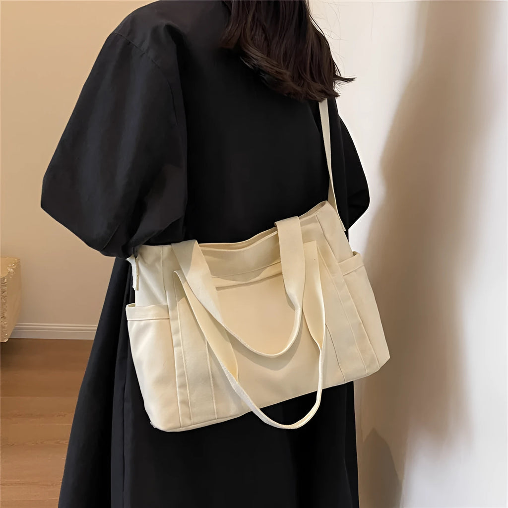 Women's polyester canvas shoulder bag with sandwich pocket in black, white, brown, or green