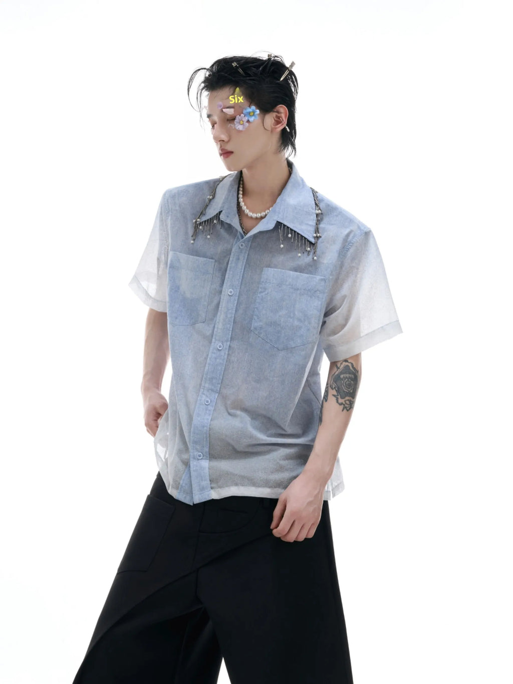 A loose-fit blue men's short sleeve shirt with a white gradient fade.
