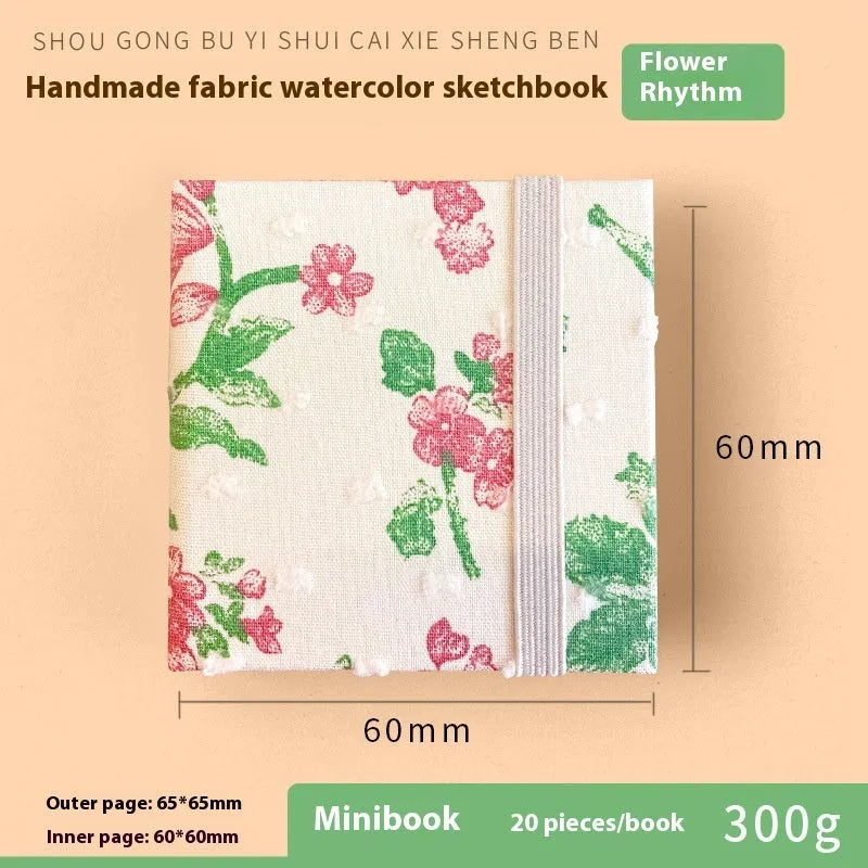 Feiluniao handmade fabric watercolour notebook in 185mm portable size, showing artistic cover design.