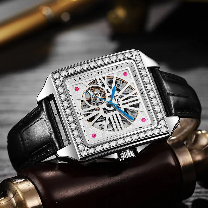 Men's square automatic watch with diamond-studded bezel on a stainless steel belt
