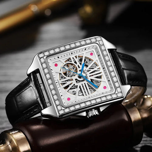 Men's square automatic watch with diamond-studded bezel on a stainless steel belt