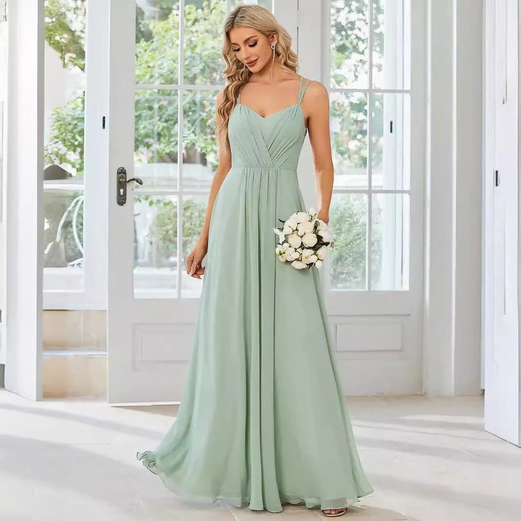 Women's light green sleeveless banquet dress with pleated A-line long skirt on a mannequin.